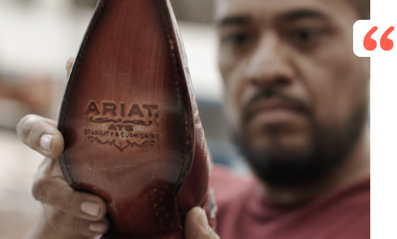 Person holding high quality footware from Ariat